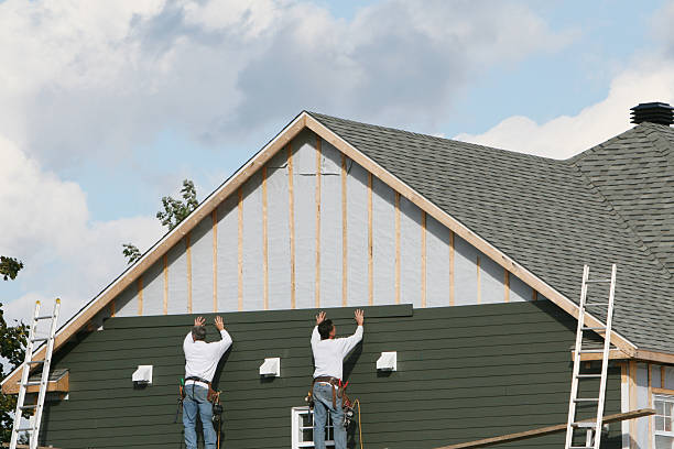 Professional Storm Damage Siding Repair technician working in Reedville, VA